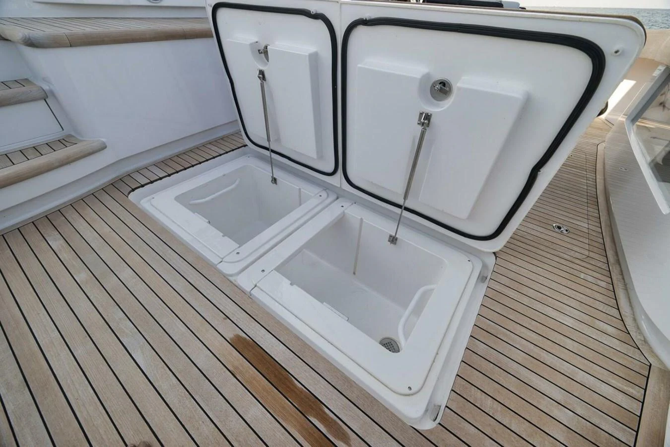 The image showcases a detailed view of the yacht's deck storage compartments, highlighting the practical design and ample storage space. aboard NIKKI BELLA Yacht for Sale