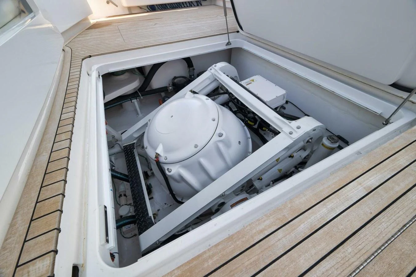 The image showcases a technical compartment of the yacht, revealing intricate machinery and equipment. aboard NIKKI BELLA Yacht for Sale