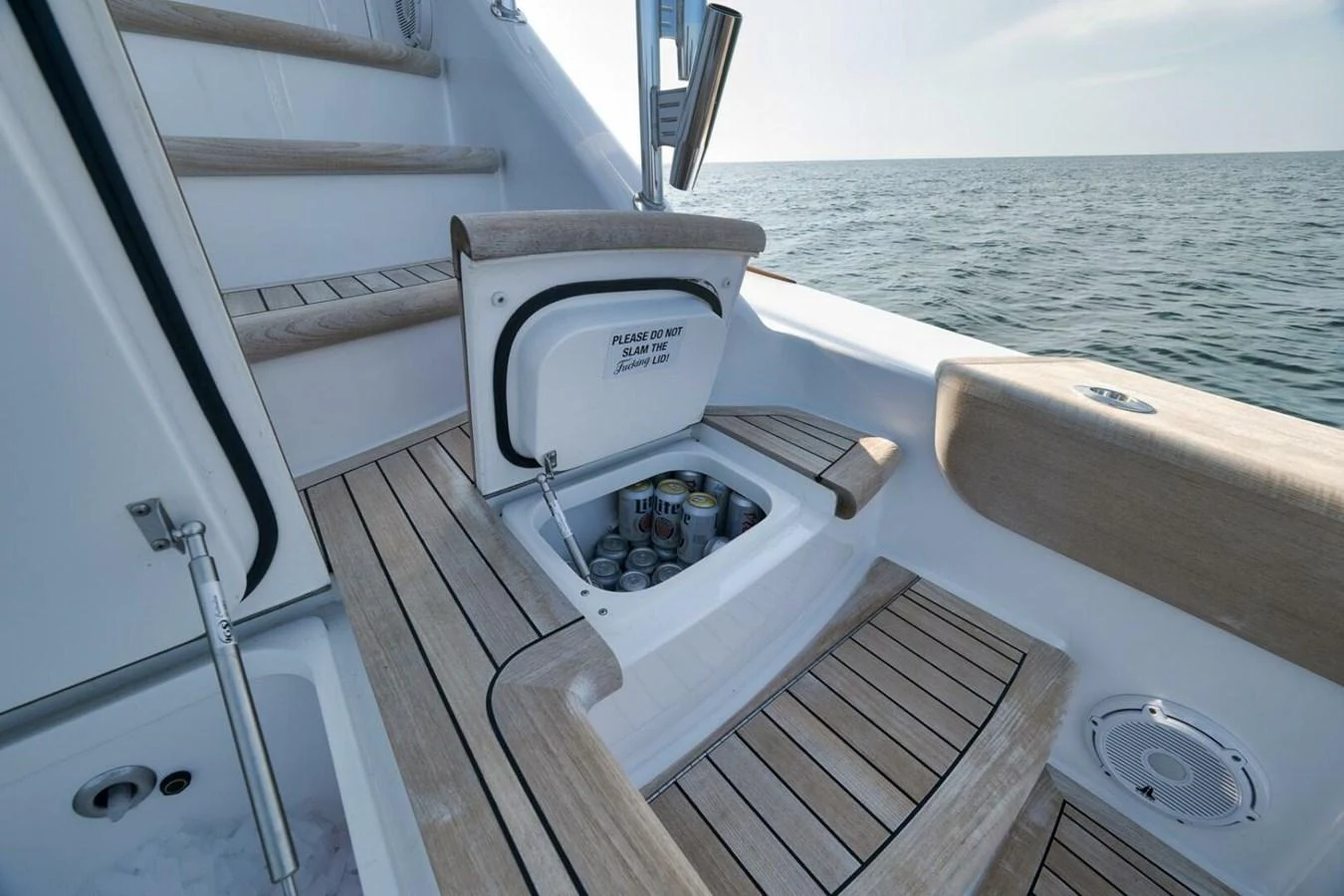 A well-designed deck area with a built-in cooler for refreshments. aboard NIKKI BELLA Yacht for Sale