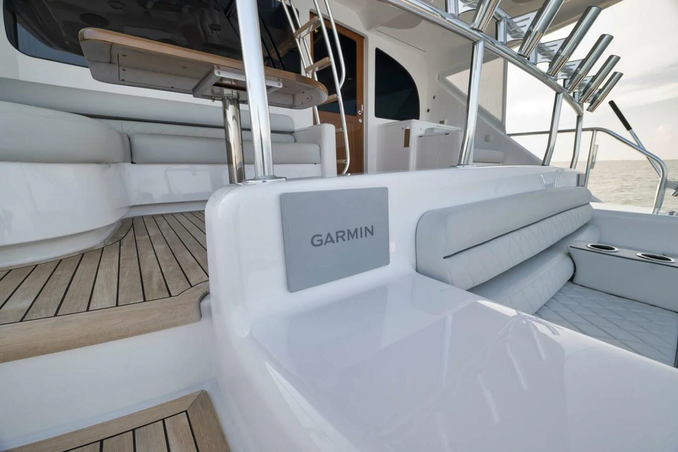 The image showcases a sleek and modern outdoor seating area with integrated Garmin electronics. aboard NIKKI BELLA Yacht for Sale