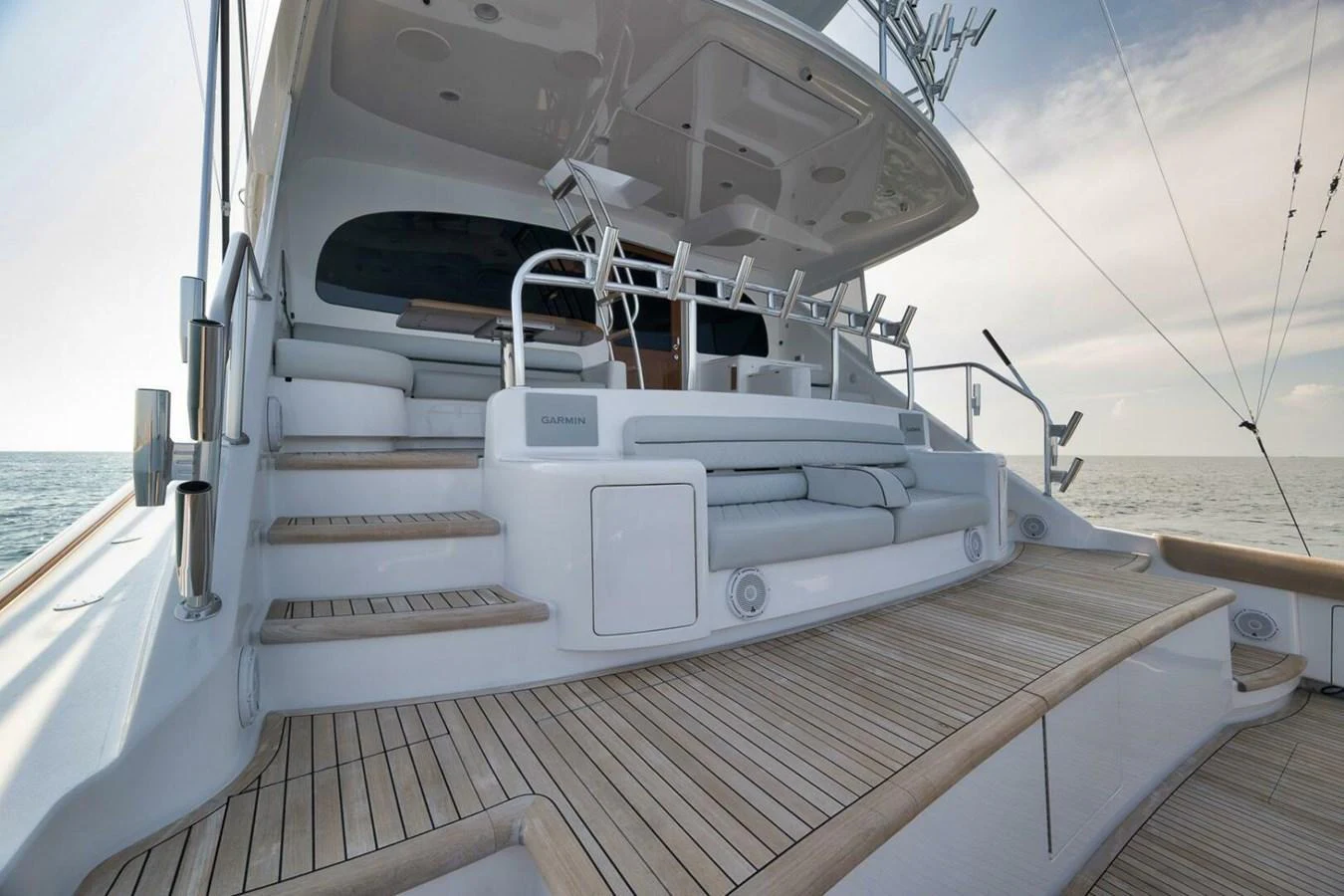 The yacht's aft deck features elegant teak flooring and comfortable seating, perfect for relaxation and socializing. aboard NIKKI BELLA Yacht for Sale