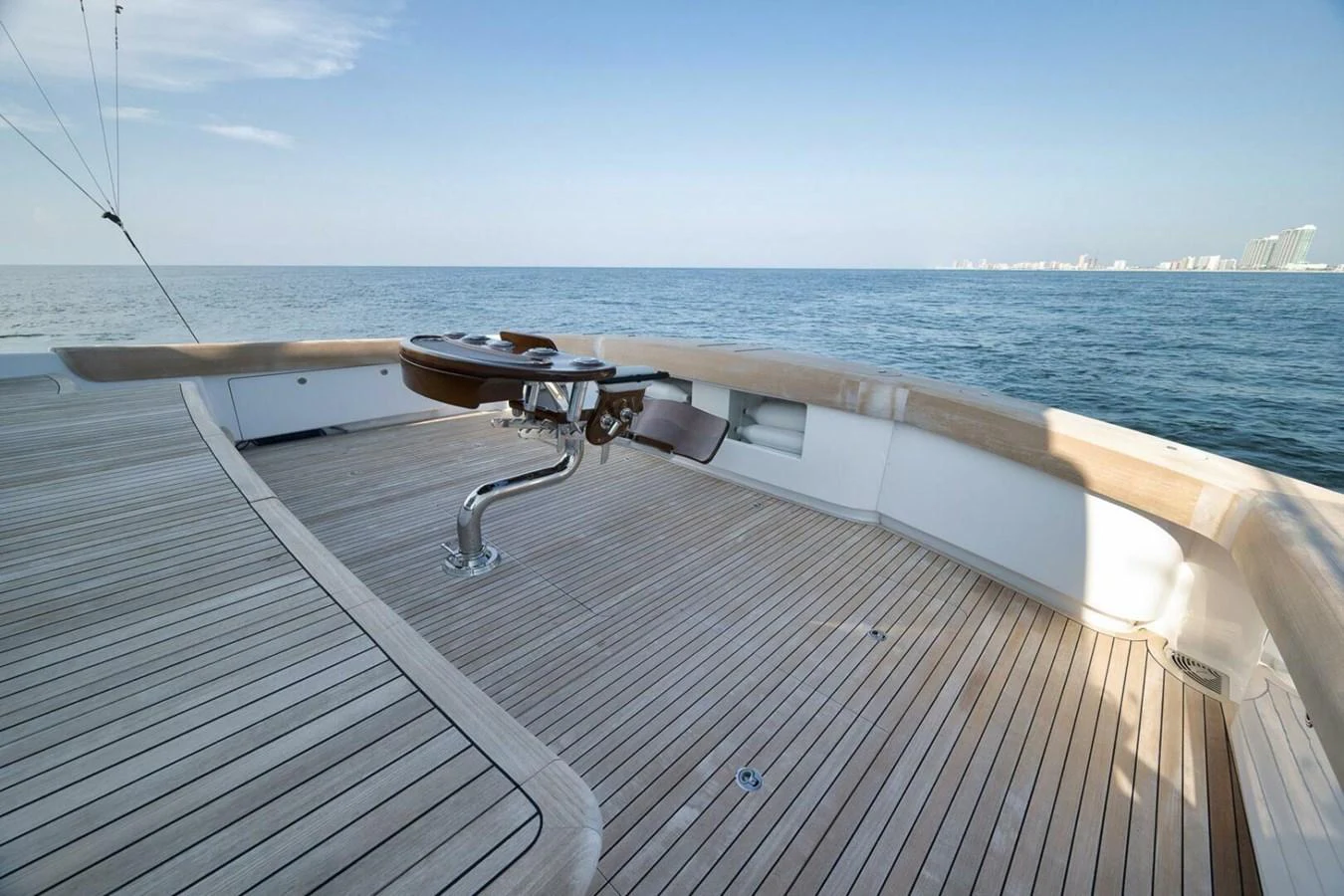 The yacht's aft deck offers a spacious and serene area with a beautiful view of the open sea. aboard NIKKI BELLA Yacht for Sale