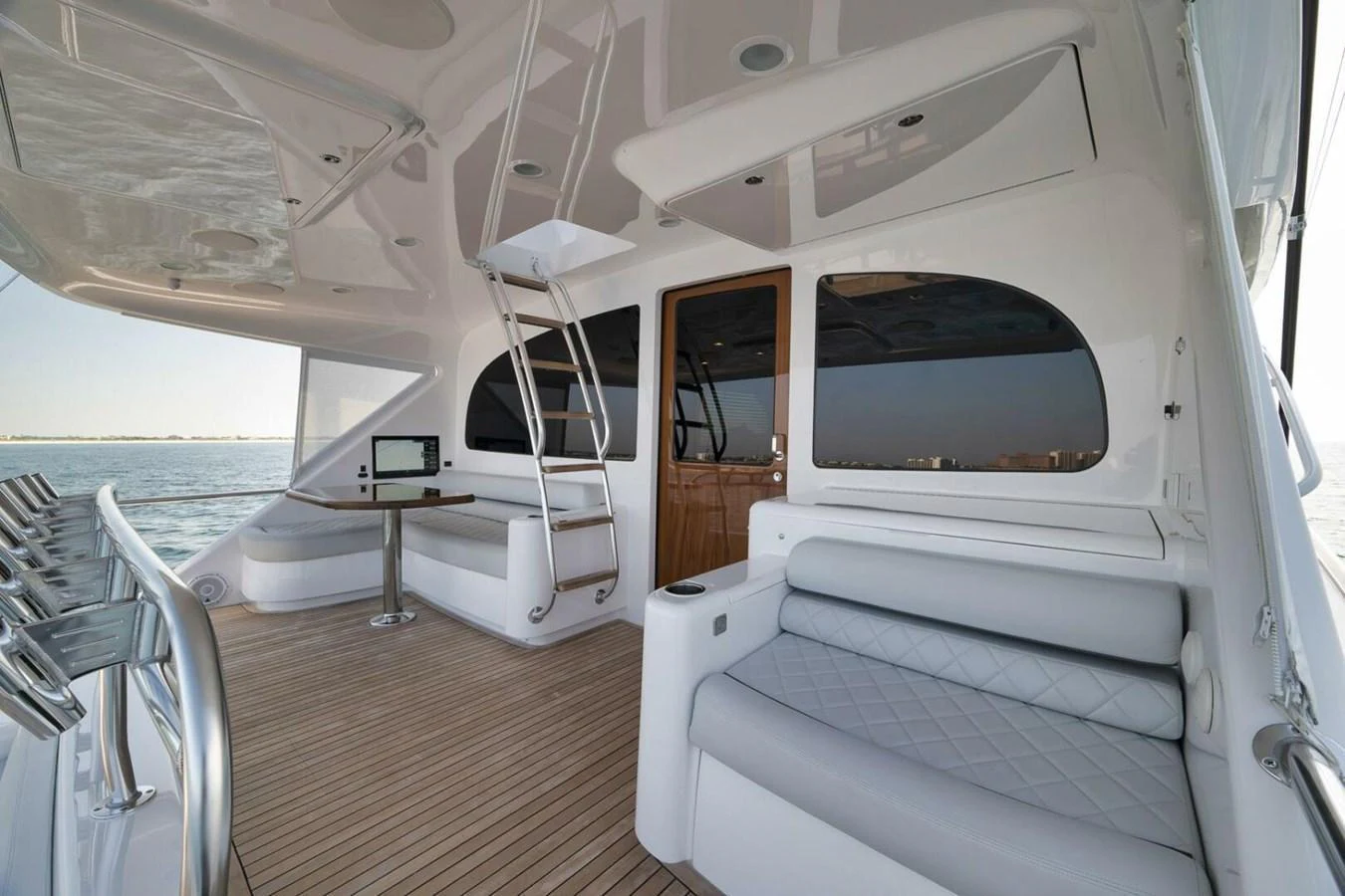 The aft deck features a comfortable seating area with a view of the water, perfect for relaxation. aboard NIKKI BELLA Yacht for Sale