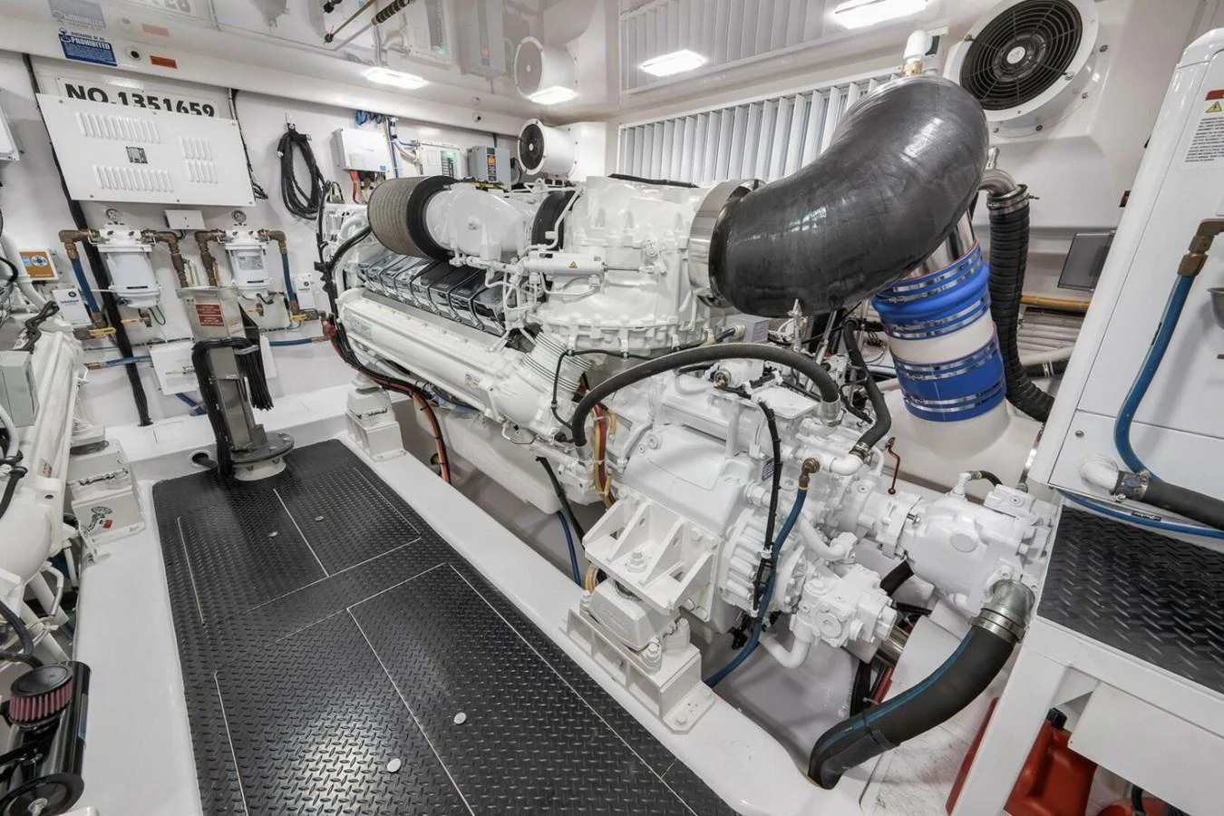 The image showcases a pristine and well-organized engine room with advanced machinery. aboard NIKKI BELLA Yacht for Sale
