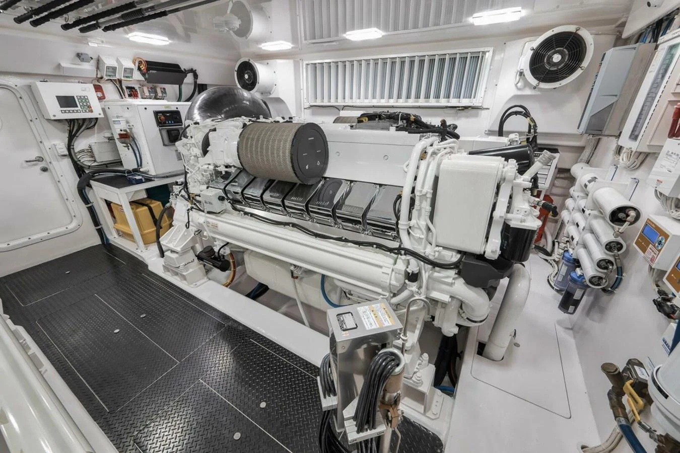The image showcases a well-organized and clean engine room with advanced machinery and equipment. aboard NIKKI BELLA Yacht for Sale