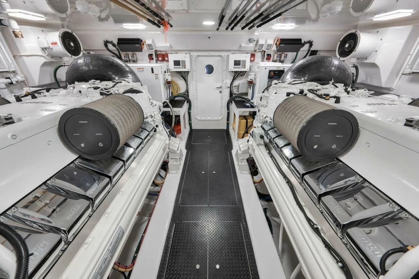 The engine room showcases a meticulously organized and high-tech space with powerful engines and advanced equipment. aboard NIKKI BELLA Yacht for Sale