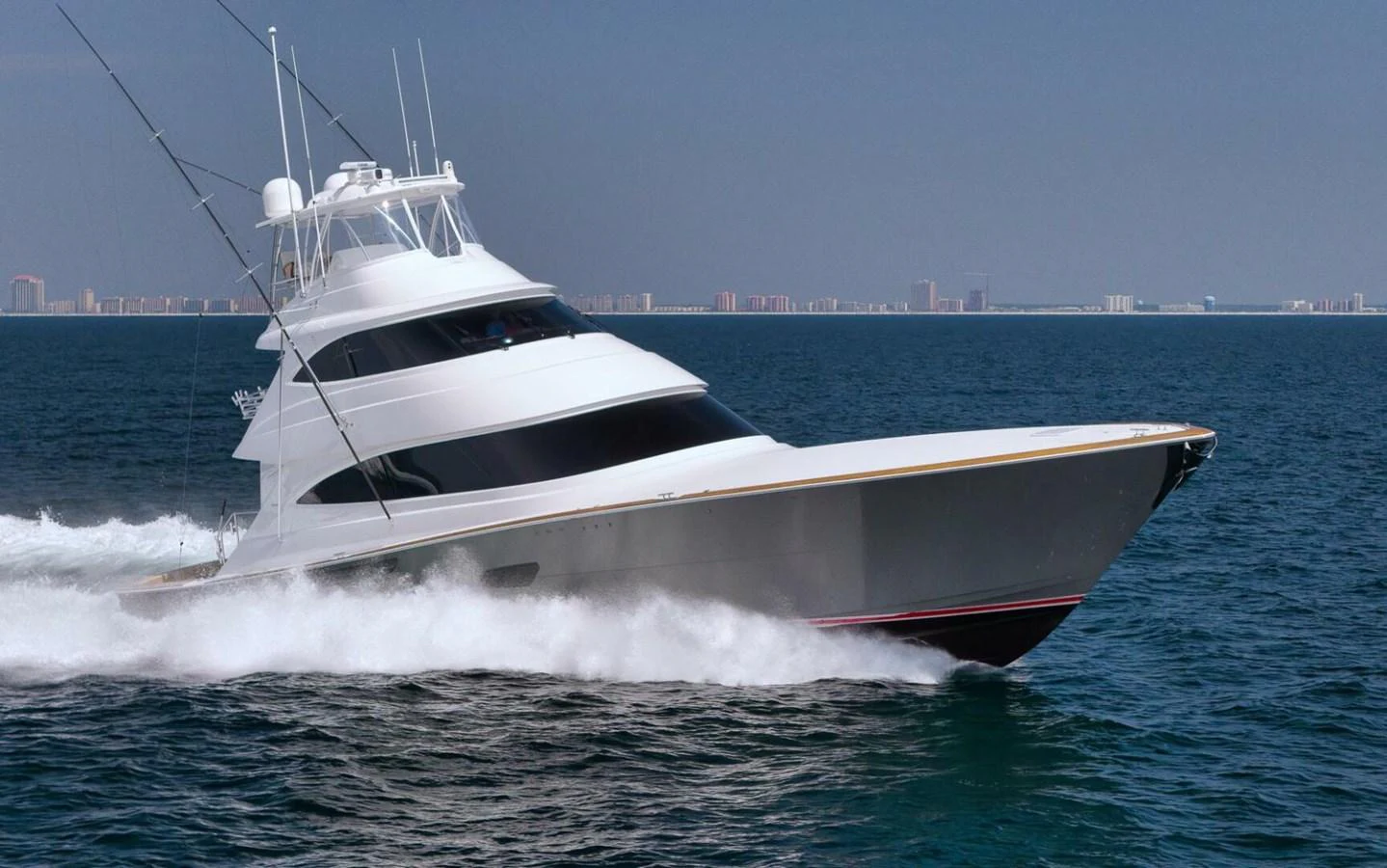 A sleek yacht cruises swiftly through the open water, showcasing its modern design and powerful performance. aboard NIKKI BELLA Yacht for Sale