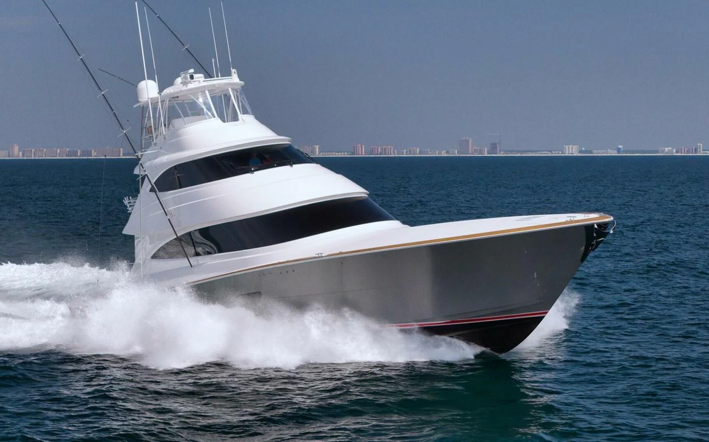 A sleek yacht cruises swiftly through the open water, showcasing its powerful design. aboard NIKKI BELLA Yacht for Sale