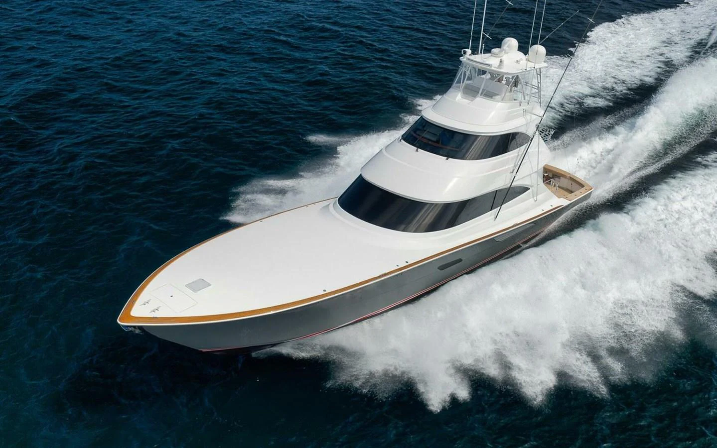 A sleek yacht cruises swiftly through the open water, showcasing its elegant design and powerful performance. aboard NIKKI BELLA Yacht for Sale