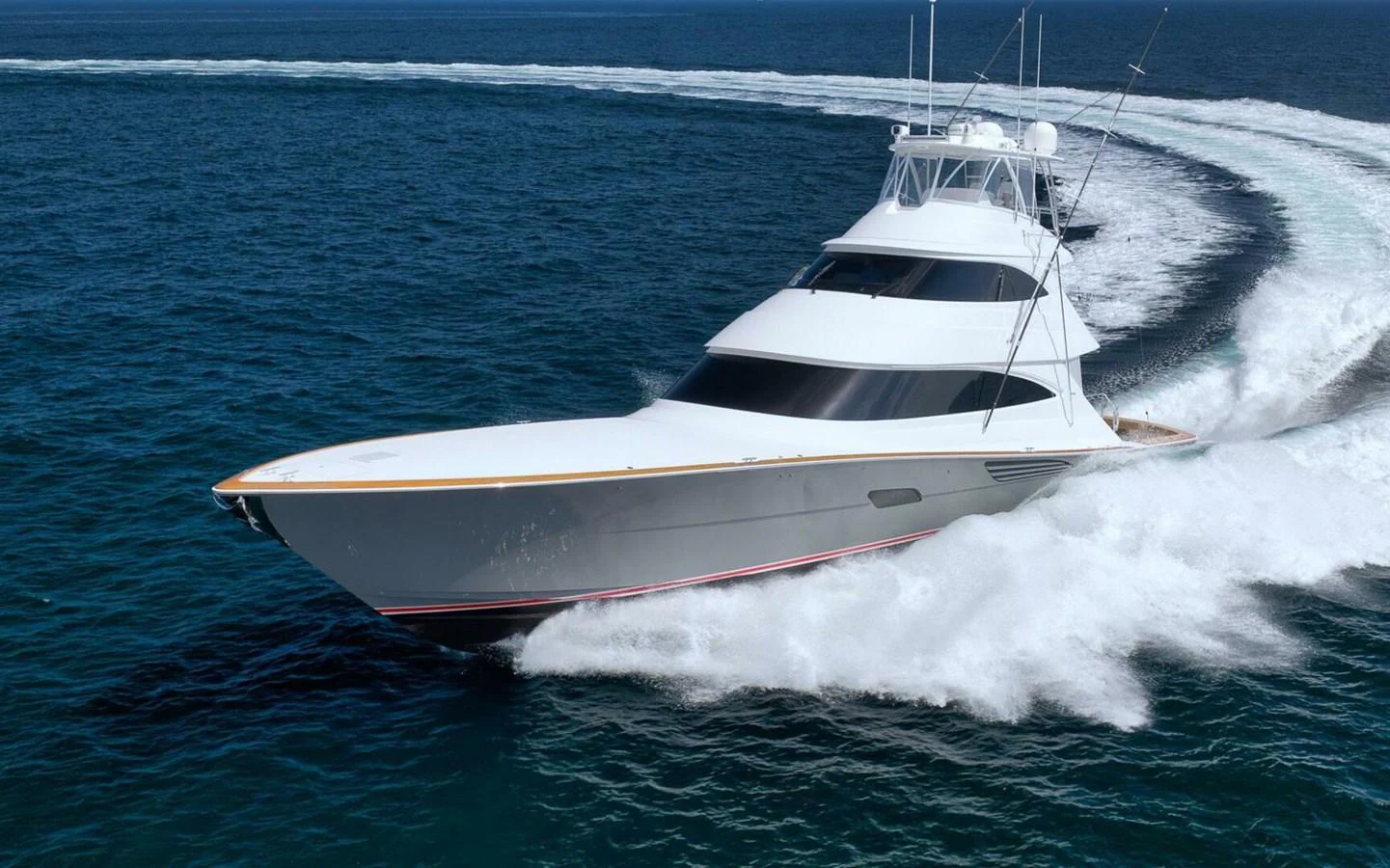 A sleek yacht cuts through the water, showcasing its impressive speed and design. aboard NIKKI BELLA Yacht for Sale