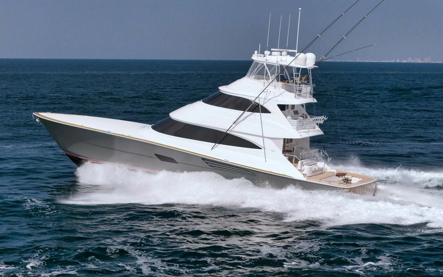 A sleek and modern yacht cruises swiftly through the open sea, showcasing its elegant design and powerful performance. aboard NIKKI BELLA Yacht for Sale