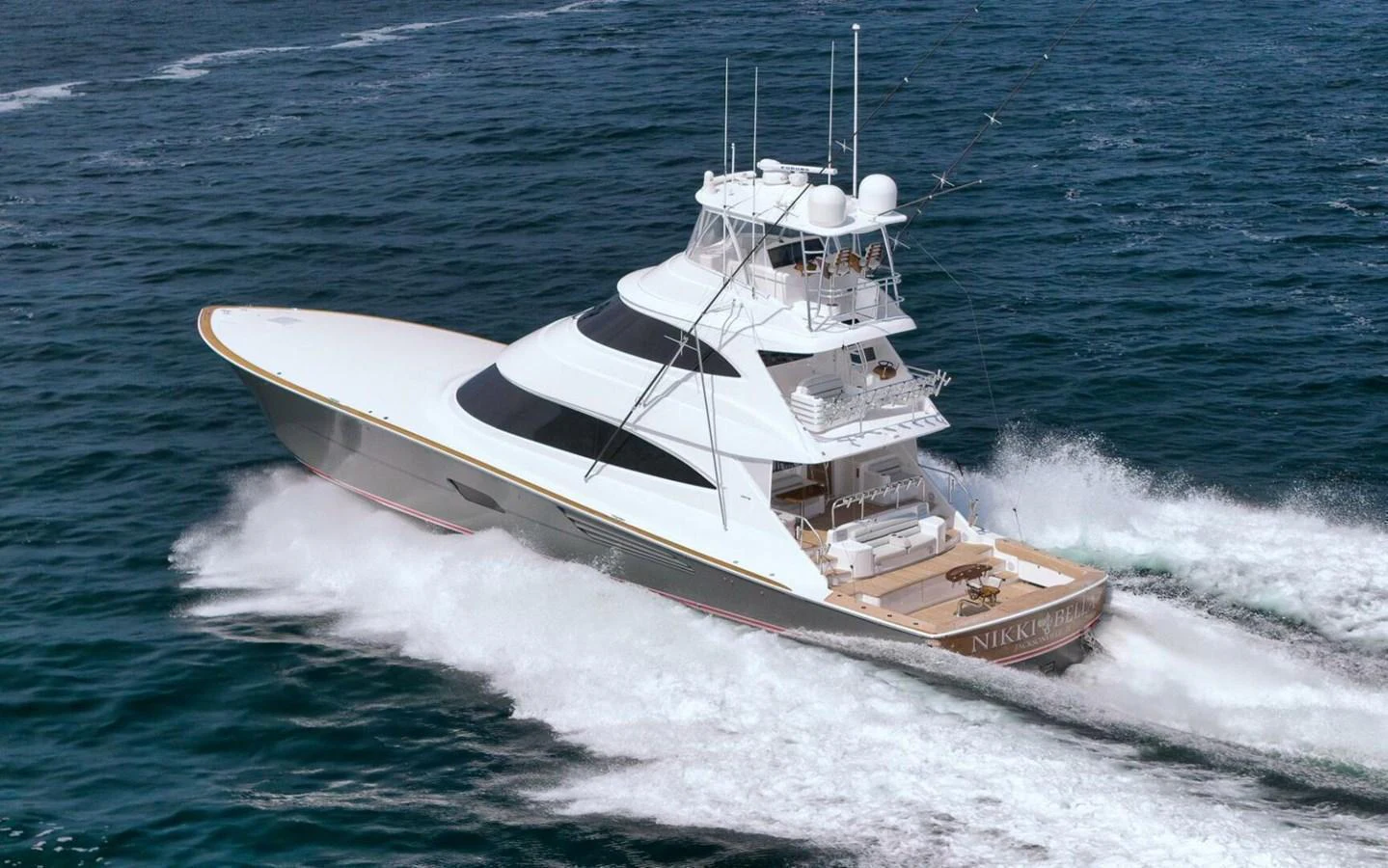 A sleek yacht cruises swiftly through the open water, showcasing its elegant design and powerful performance. aboard NIKKI BELLA Yacht for Sale