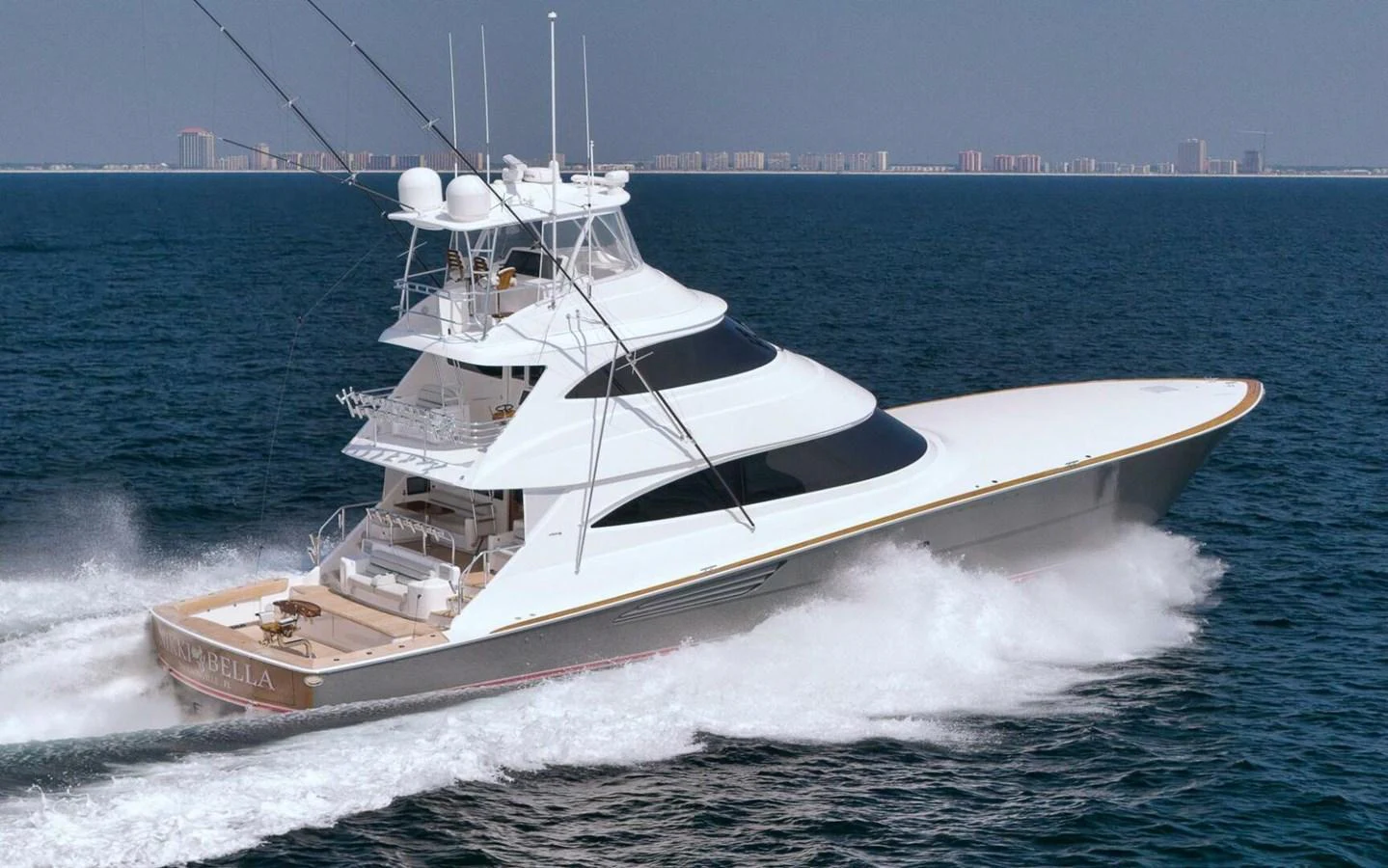 A sleek yacht cruises swiftly through the open water, showcasing its elegant design and powerful performance. aboard NIKKI BELLA Yacht for Sale