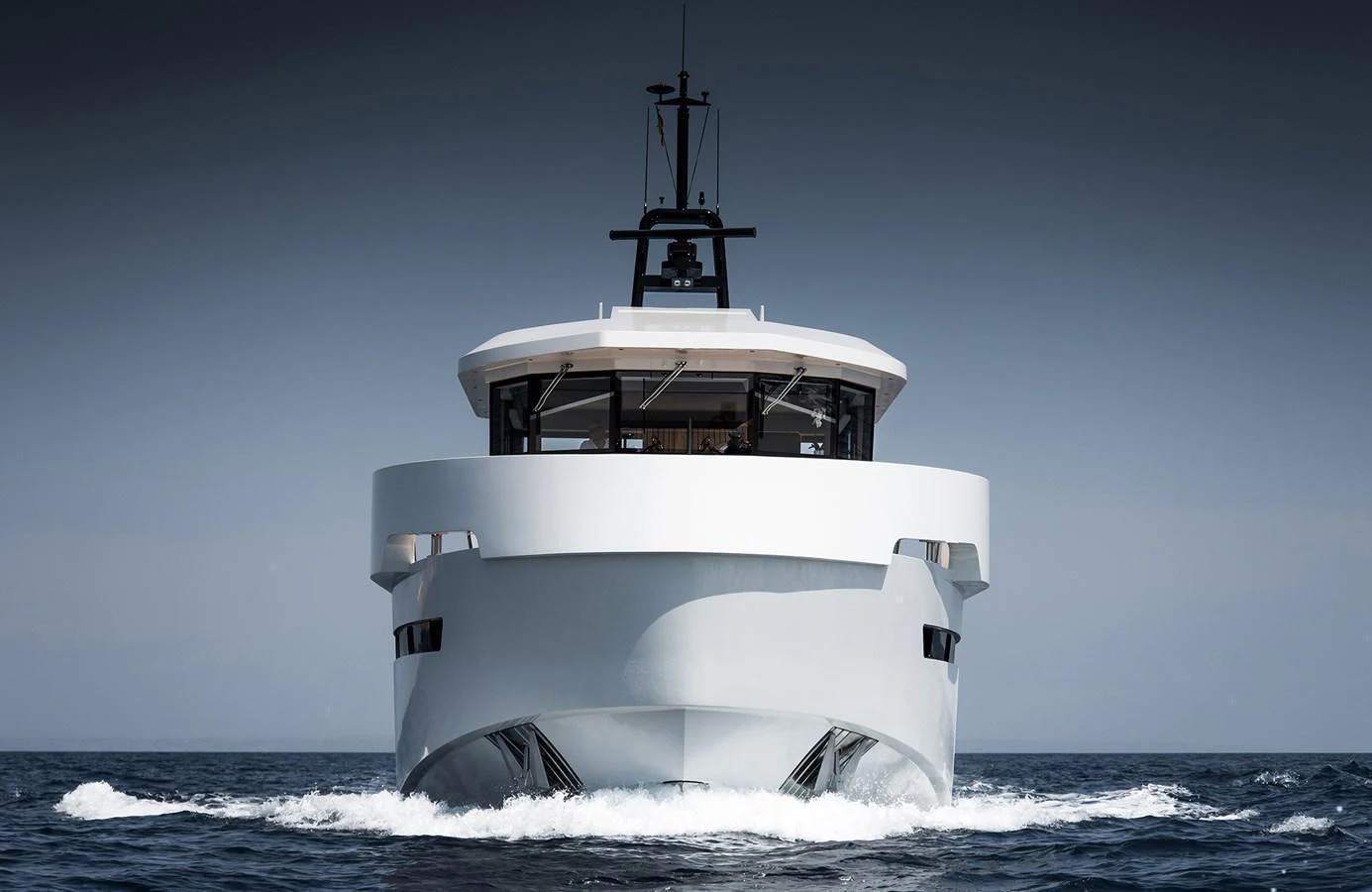 A sleek and modern yacht cuts through the water, showcasing its impressive bow design. aboard 27 YXT Yacht for Sale