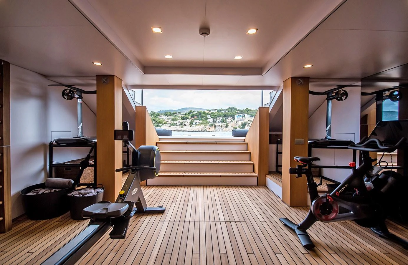 The yacht features a well-equipped gym with a view of the surrounding landscape. aboard 27 YXT Yacht for Sale