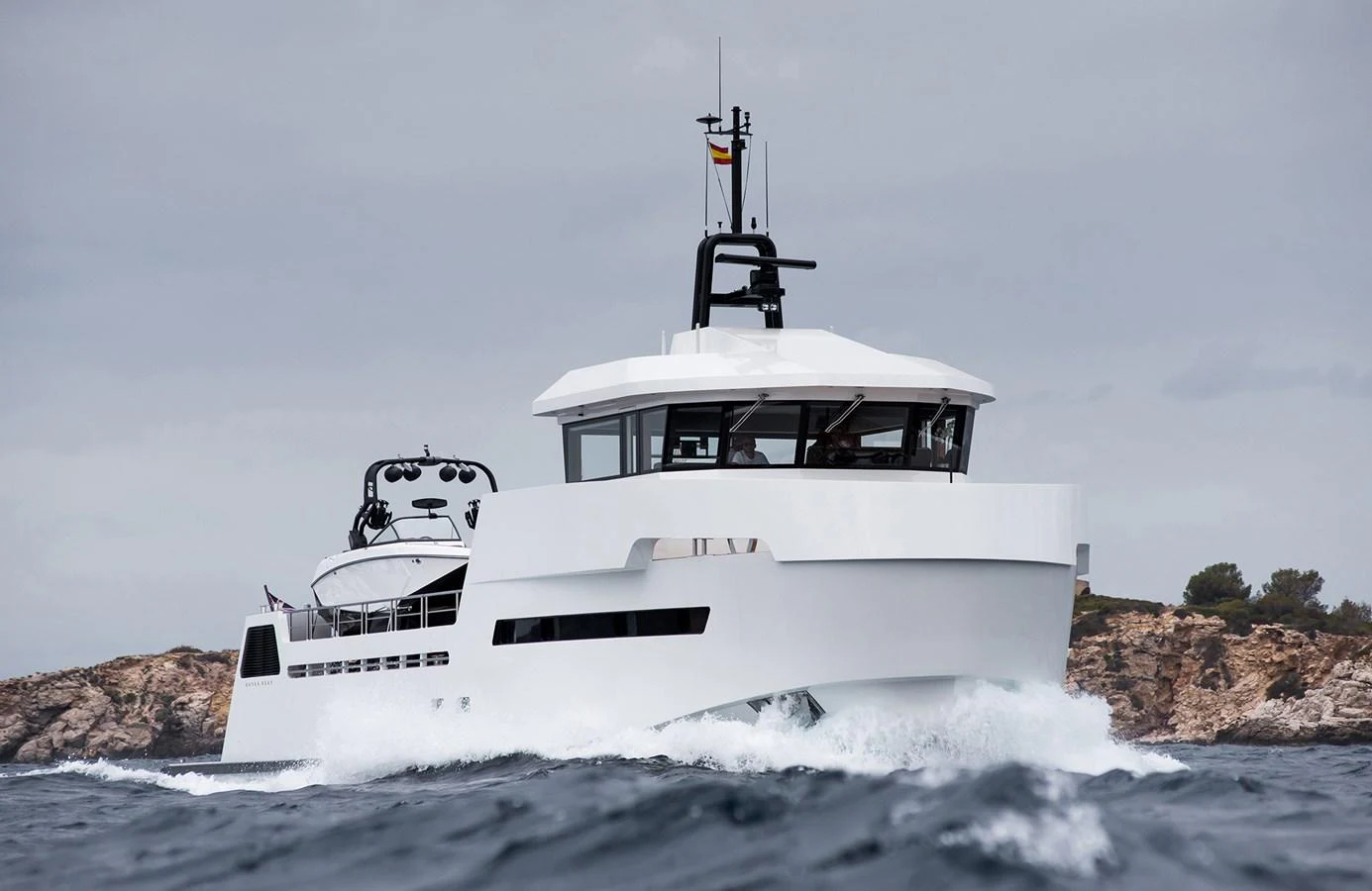 A modern yacht cruises through the waves with a sleek, angular design. aboard 27 YXT Yacht for Sale