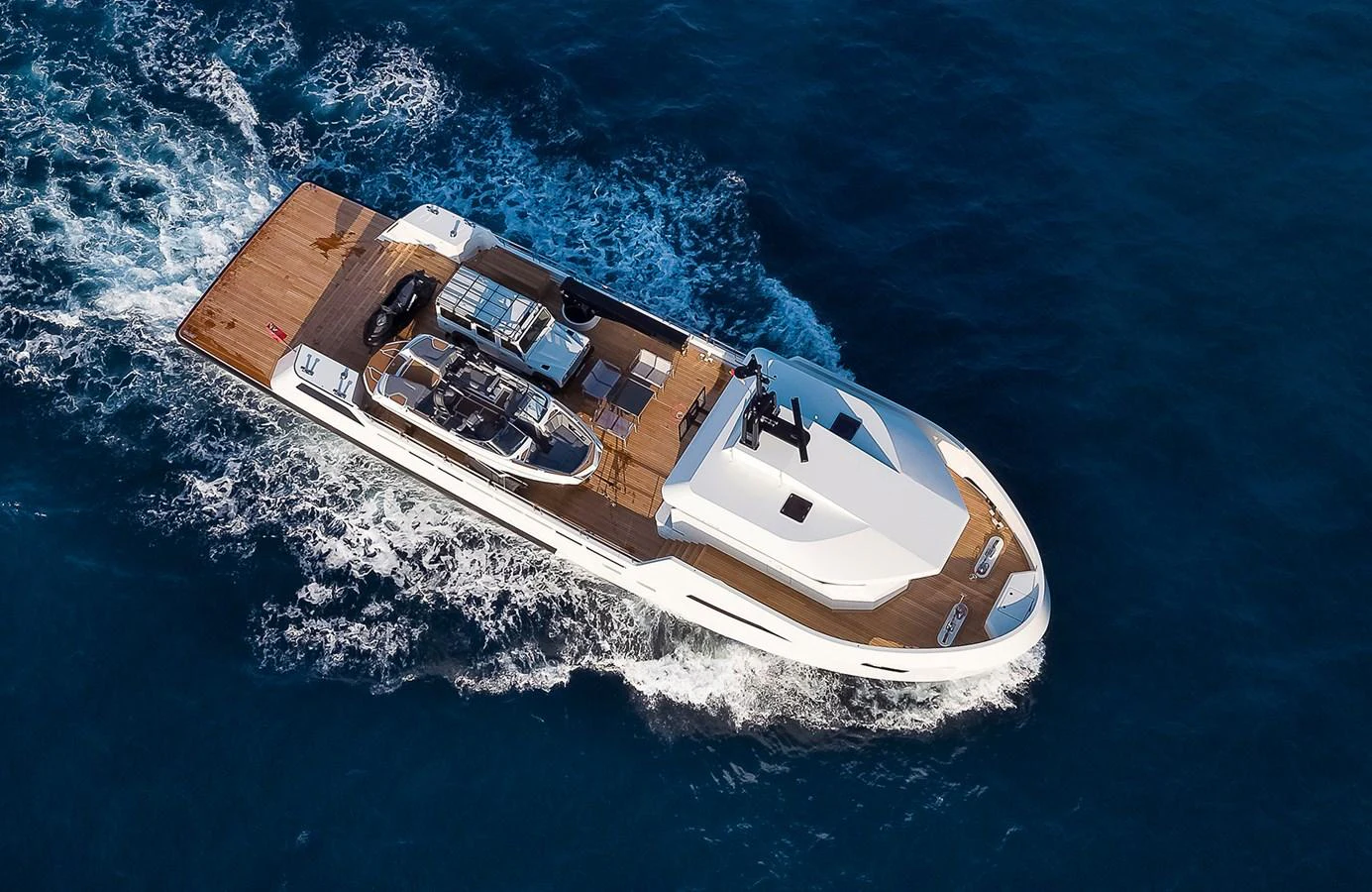 A sleek, modern yacht cruises through the open water, showcasing its spacious deck and elegant design. aboard 27 YXT Yacht for Sale