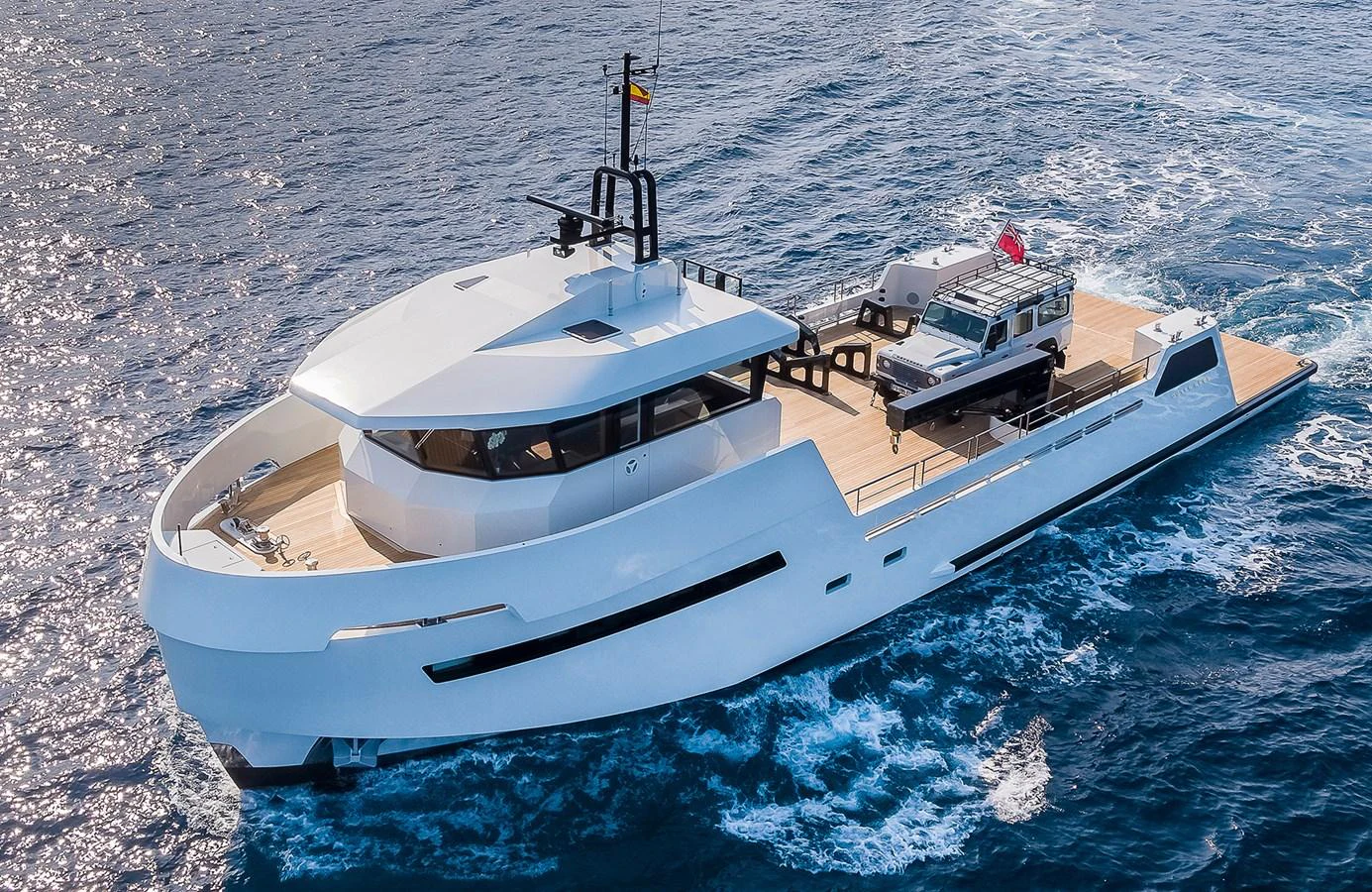 A sleek, modern yacht cruises through the open water, showcasing its elegant design and spacious deck. aboard 27 YXT Yacht for Sale