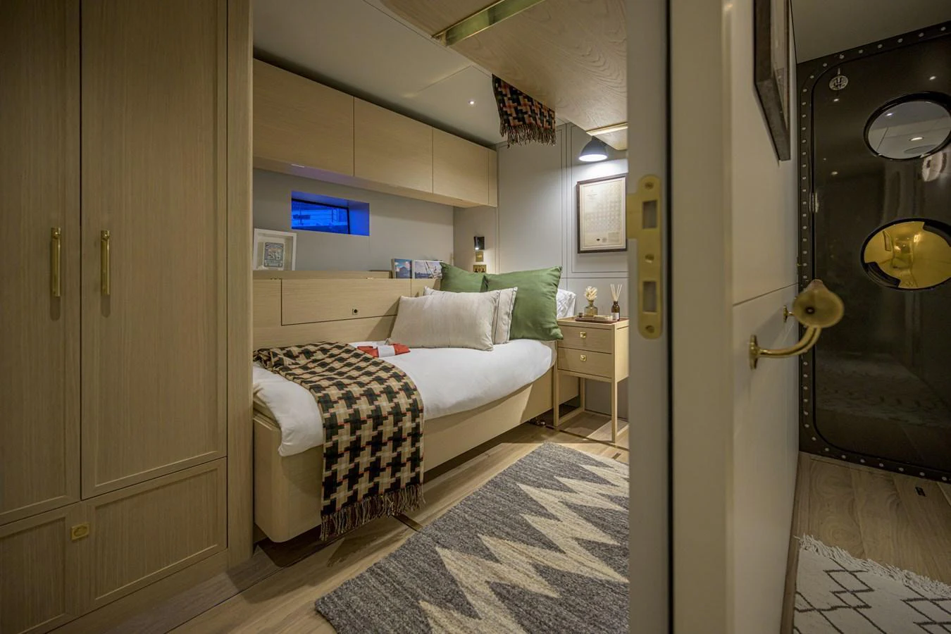 A cozy stateroom with a comfortable bed and stylish decor. aboard ARKSEN 85 Yacht for Sale