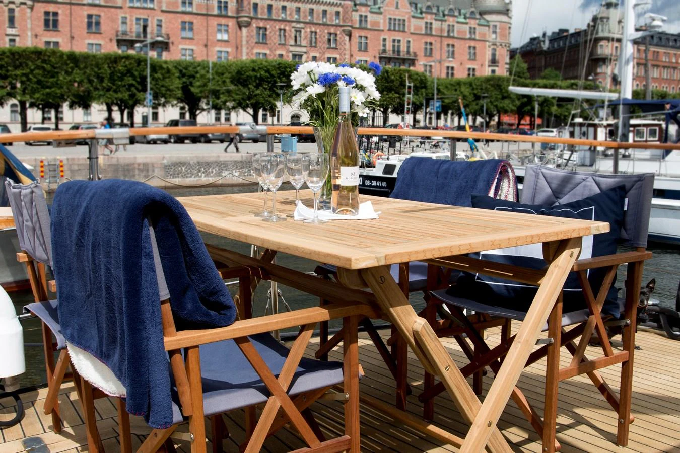 The aft deck features a stylish dining area with comfortable seating and a beautiful view. aboard STELLA NOVA Yacht for Sale