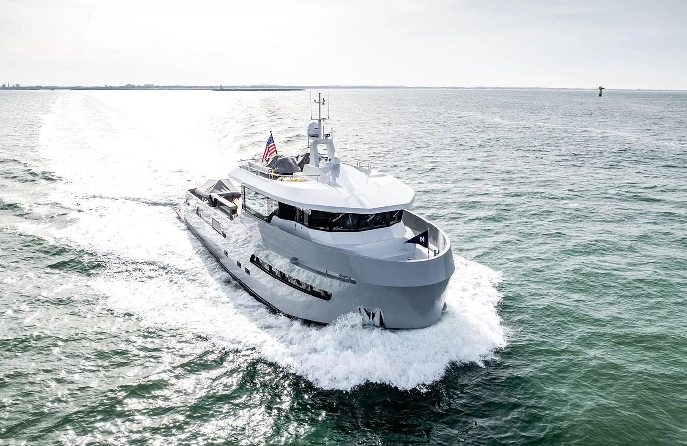 A sleek and modern yacht cruises gracefully on open waters. aboard 27 CROSSOVER Yacht for Sale