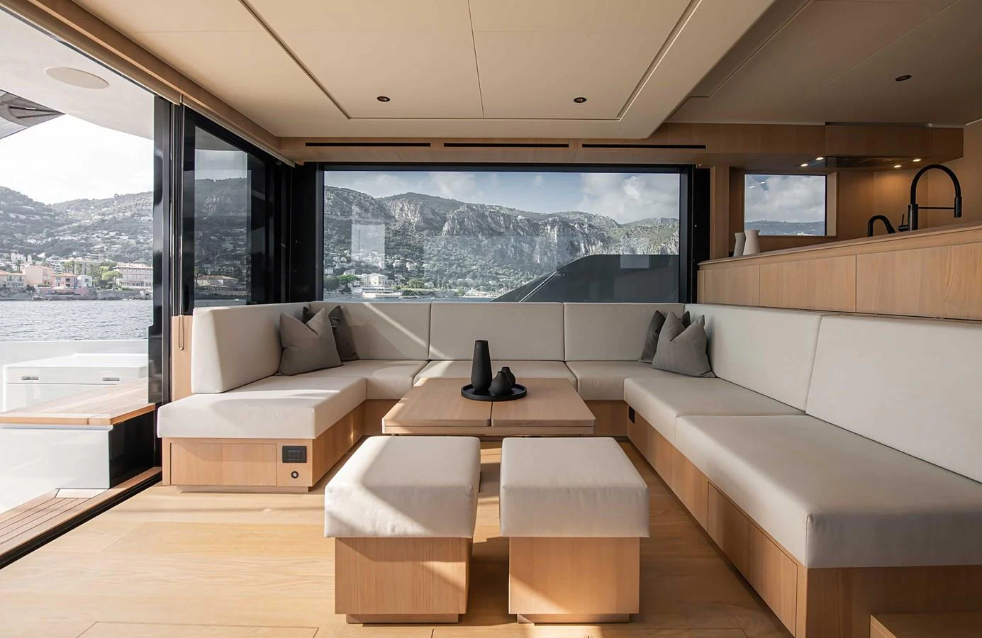 The salon offers a spacious and elegant seating area with panoramic views. aboard 27 CROSSOVER Yacht for Sale