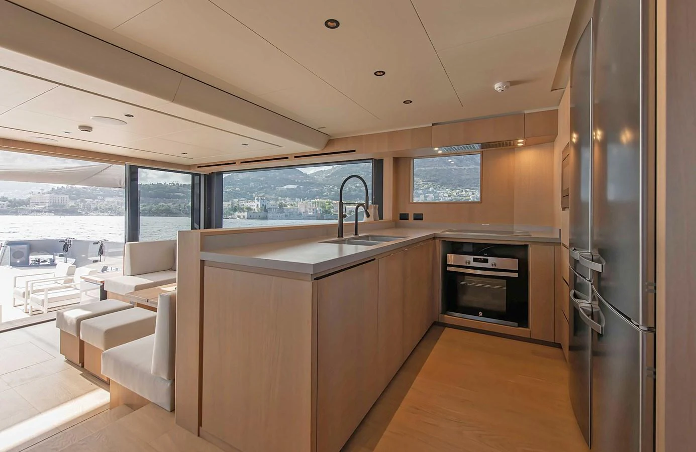 The yacht's galley features modern appliances and a spacious layout with panoramic views. aboard 27 CROSSOVER Yacht for Sale