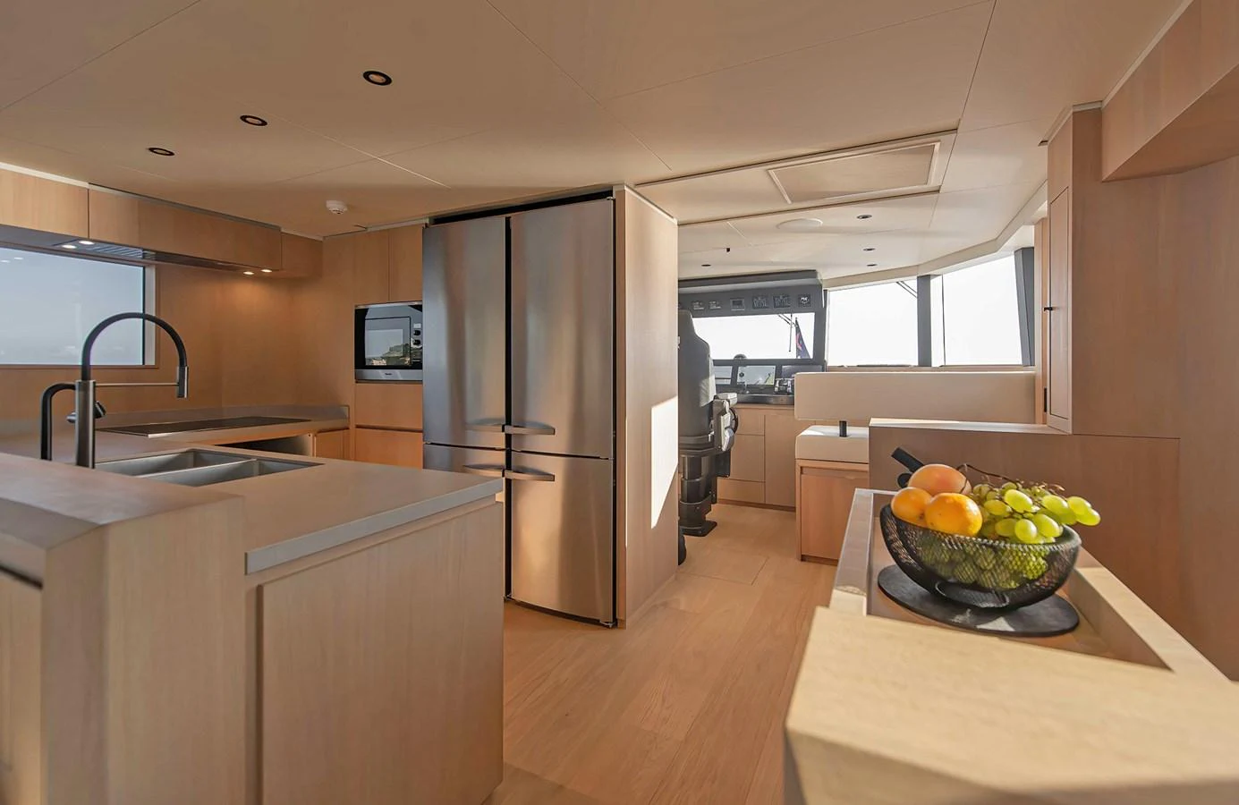 The yacht's galley features modern appliances and ample counter space, creating a functional and stylish cooking area. aboard 27 CROSSOVER Yacht for Sale