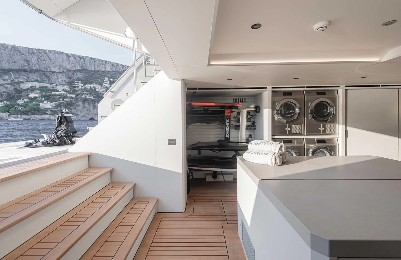 The yacht features a well-equipped laundry area with modern appliances and ample storage space. aboard 27 CROSSOVER Yacht for Sale