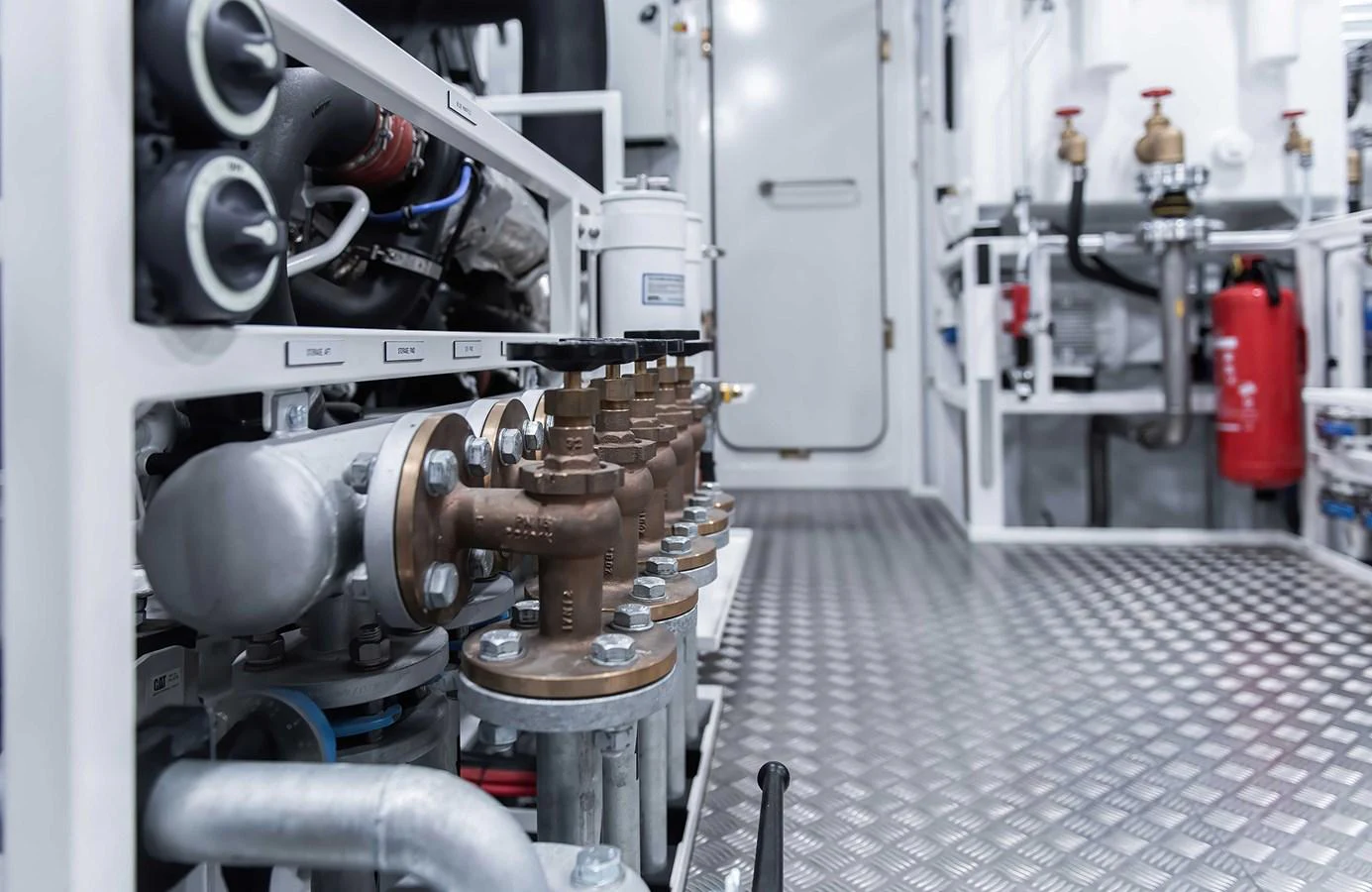 The image showcases the technical and mechanical details of the yacht's engine room. aboard 27 CROSSOVER Yacht for Sale