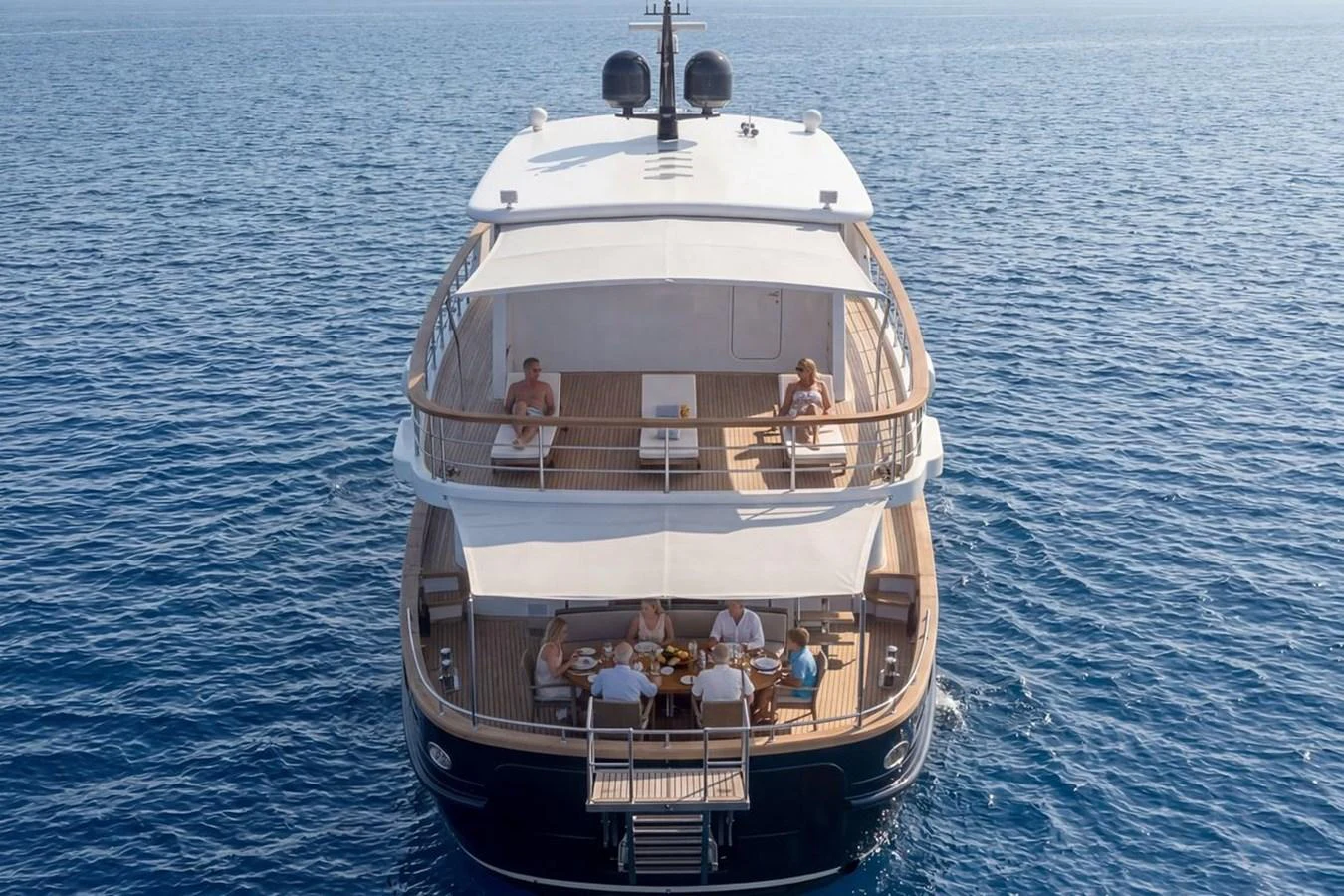 The yacht's aft deck offers a spacious and inviting area for relaxation and dining, with stunning views of the open sea. aboard SVETLANA Yacht for Sale