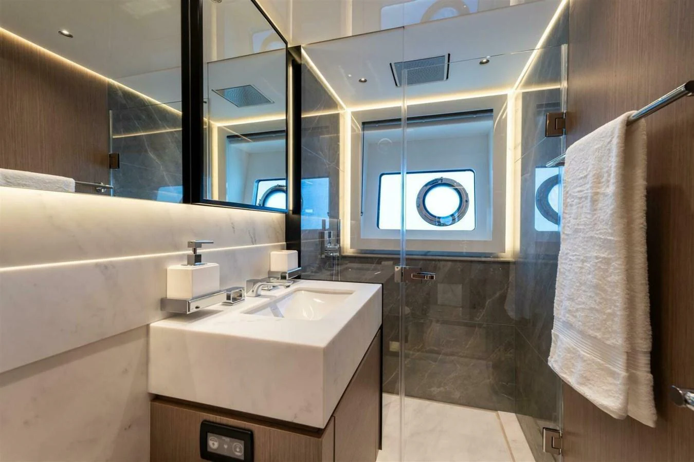 The yacht's bathroom features a sleek design with modern fixtures and a spacious shower area. aboard 90 OCEAN ENCLOSED Yacht for Sale