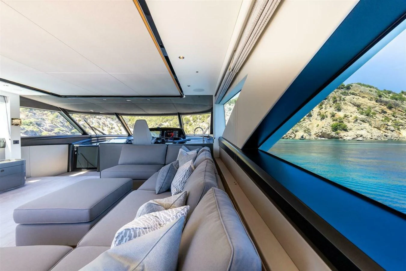 The salon offers a spacious and luxurious seating area with panoramic views of the sea. aboard 90 OCEAN ENCLOSED Yacht for Sale