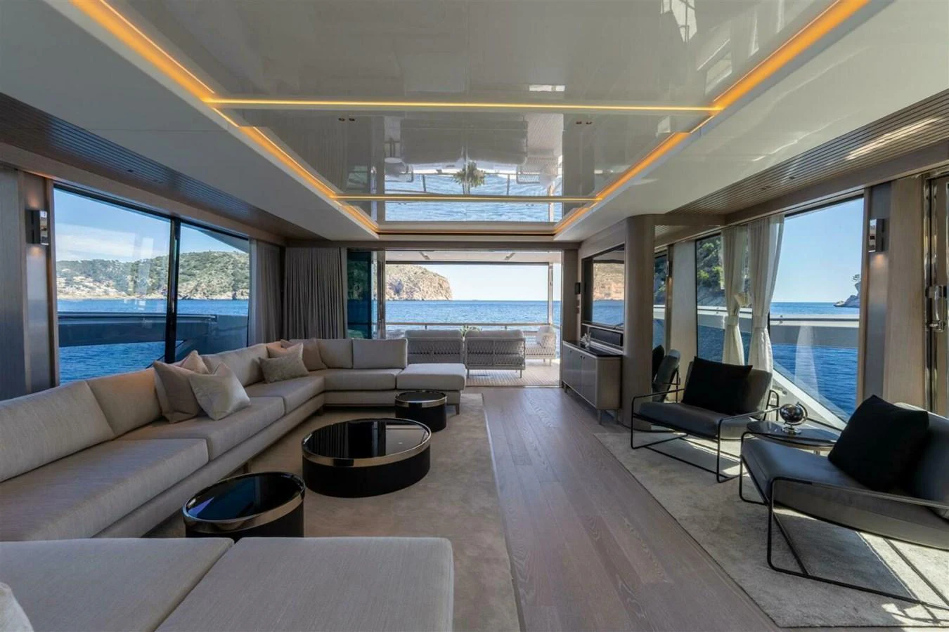 The spacious salon offers panoramic views and luxurious seating arrangements. aboard 90 OCEAN ENCLOSED Yacht for Sale