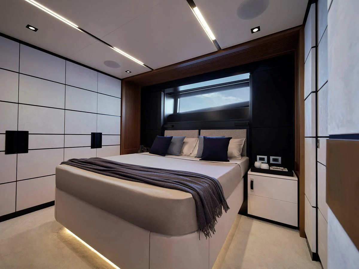 A luxurious stateroom featuring a large bed with modern decor and ambient lighting. aboard WALLYWHY200 Yacht for Sale