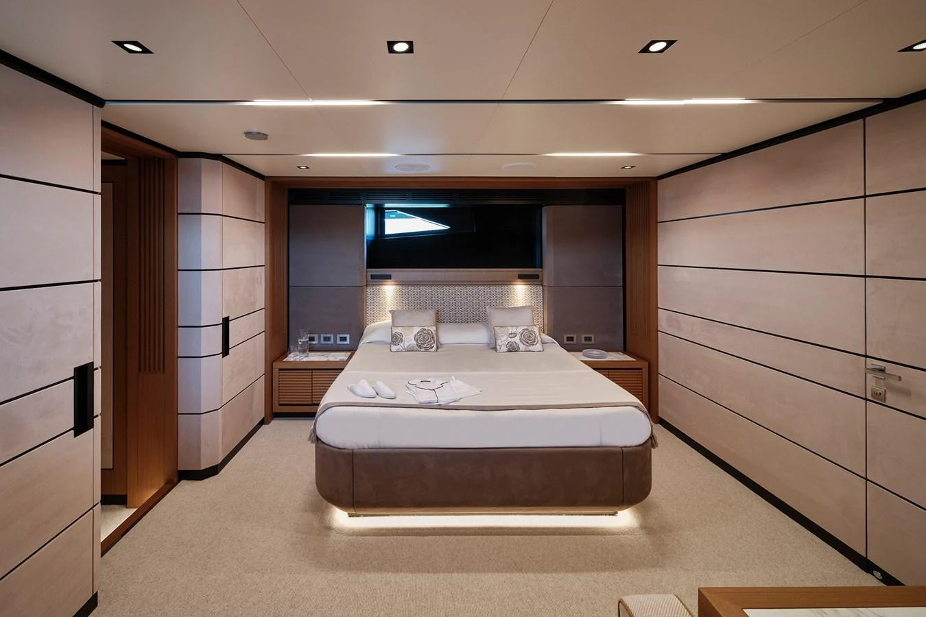 The master stateroom features a luxurious bed with elegant lighting and modern decor. aboard WALLYWHY200 Yacht for Sale