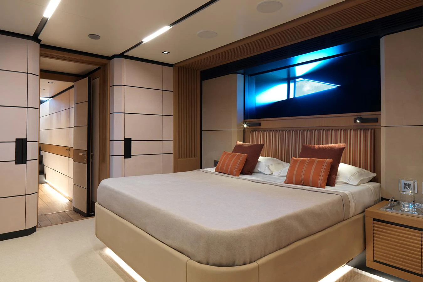 The master stateroom features a spacious bed with elegant decor and ambient lighting. aboard WALLYWHY200 Yacht for Sale