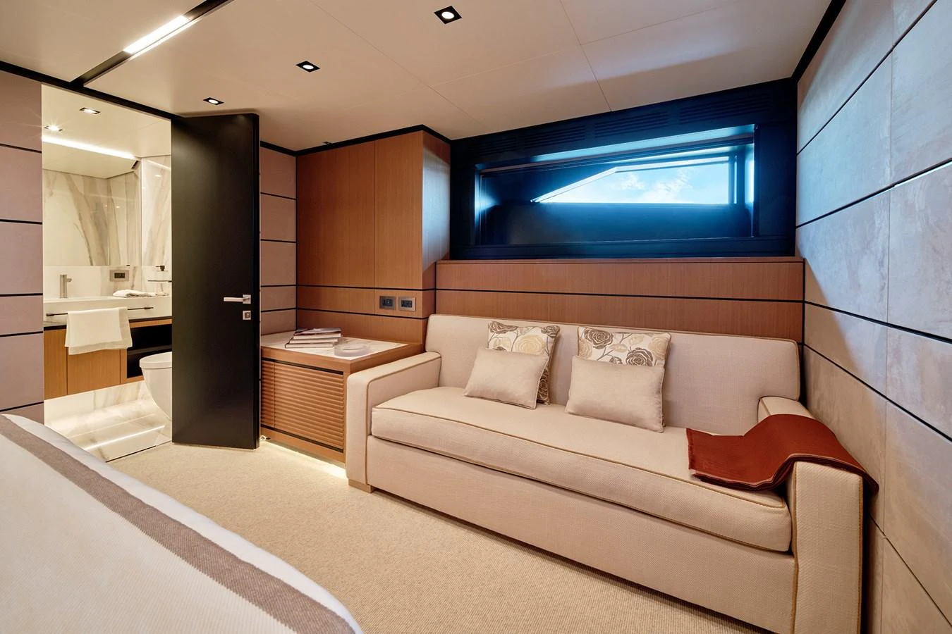 This cozy stateroom features a comfortable sofa, modern decor, and a private en-suite bathroom. aboard WALLYWHY200 Yacht for Sale