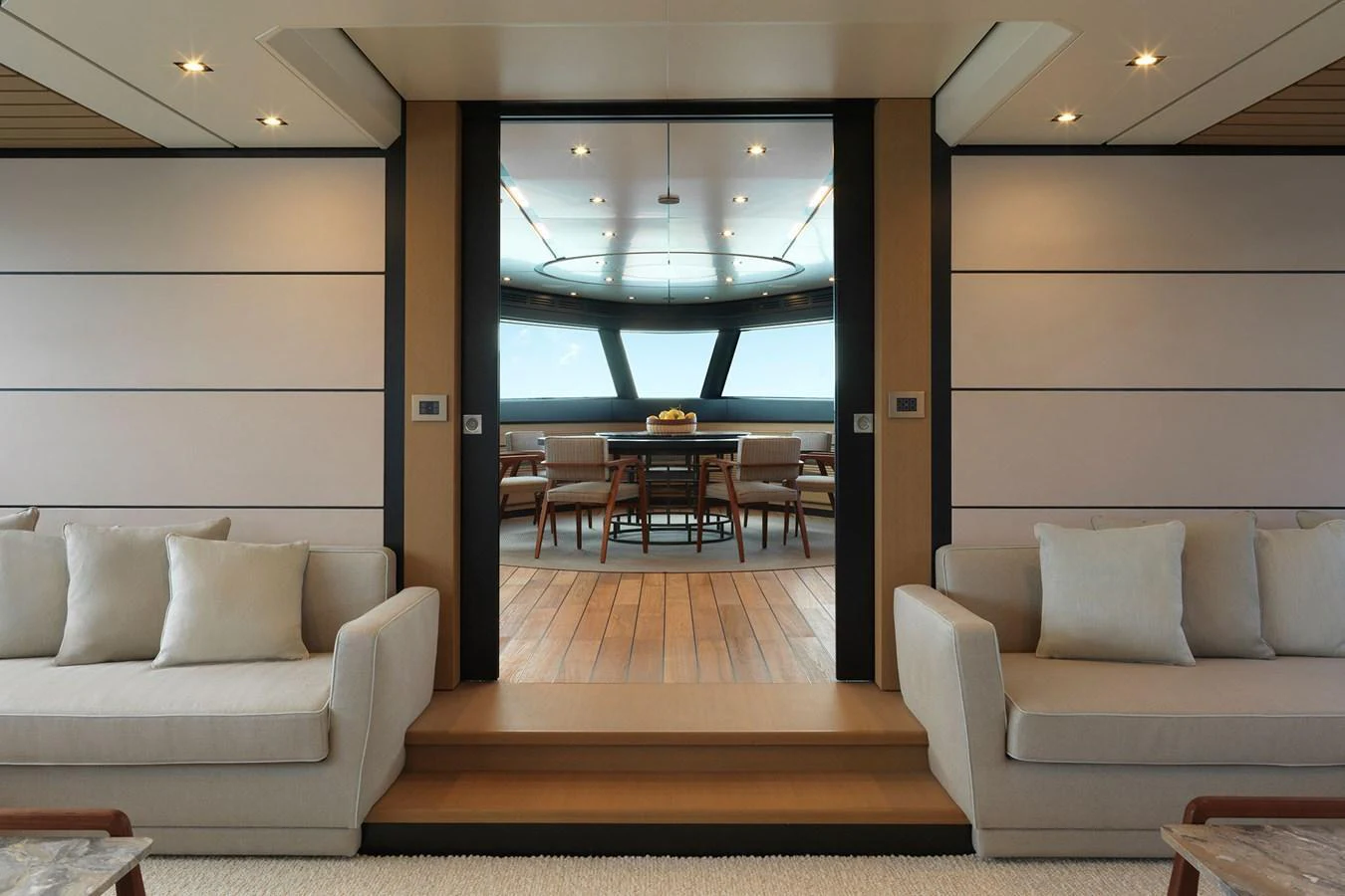 A luxurious interior space with comfortable seating and a dining area with a view. aboard WALLYWHY200 Yacht for Sale
