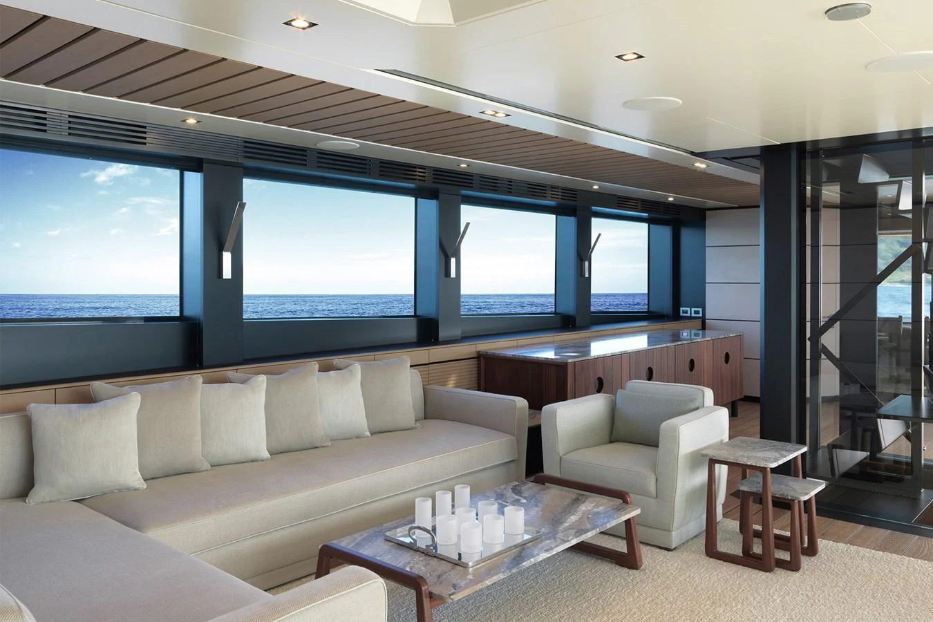 The salon features luxurious seating with panoramic ocean views through large windows. aboard WALLYWHY200 Yacht for Sale