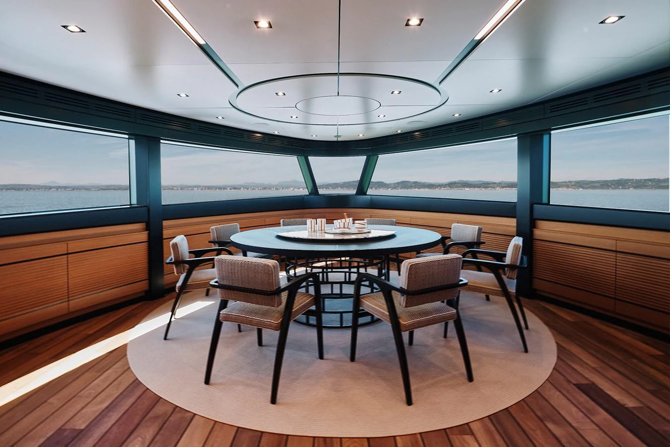 A luxurious dining area with panoramic ocean views and elegant seating. aboard WALLYWHY200 Yacht for Sale