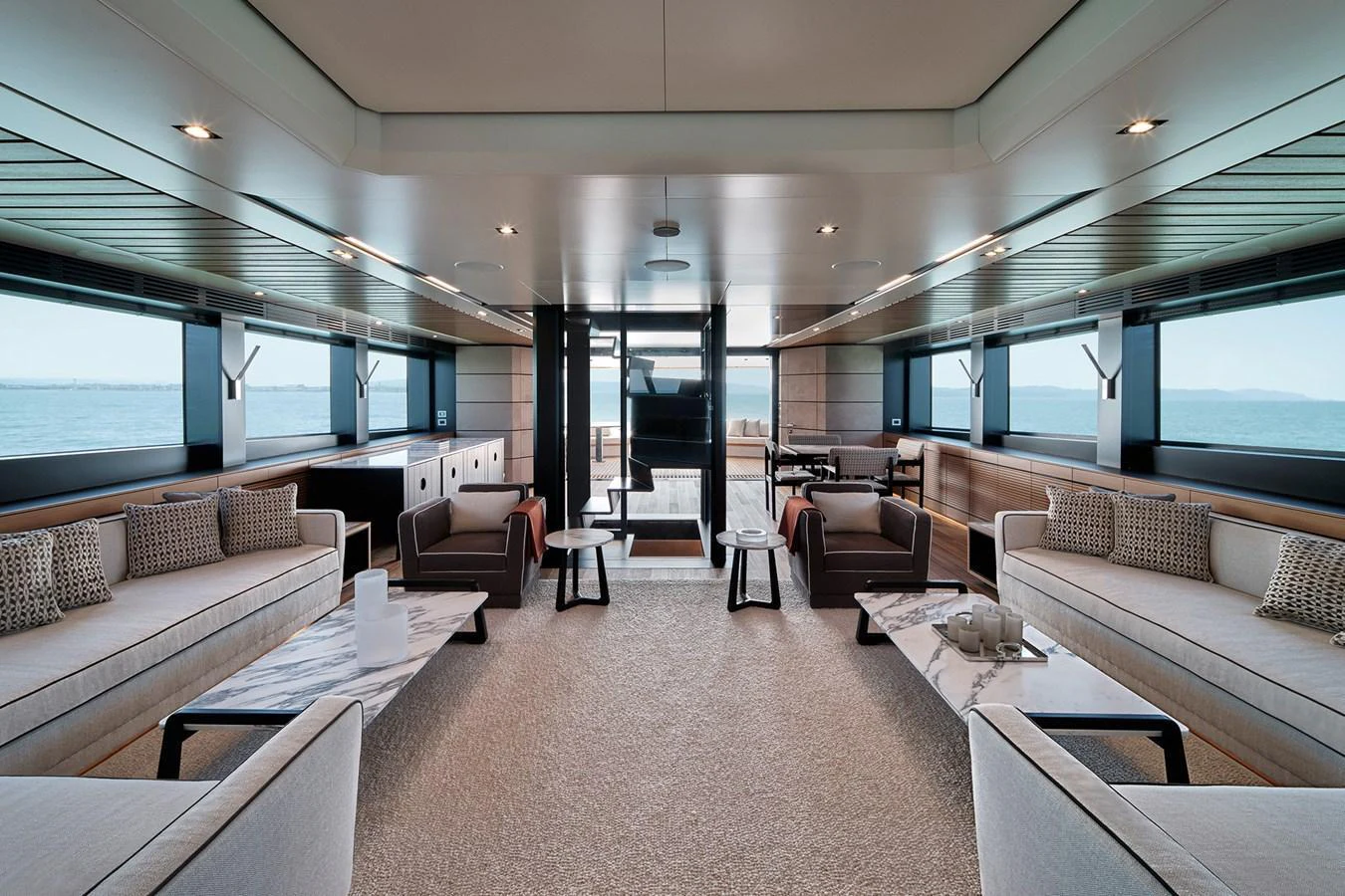The spacious salon features elegant seating arrangements and panoramic windows offering stunning sea views. aboard WALLYWHY200 Yacht for Sale