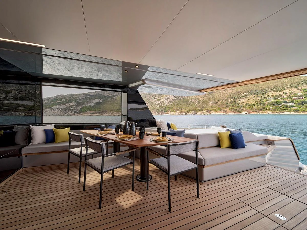 The aft deck offers a luxurious dining area with stunning views of the surrounding waters. aboard WALLYWHY200 Yacht for Sale