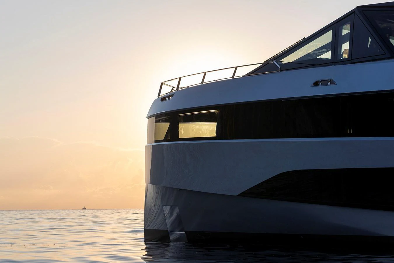 A sleek yacht with modern lines is captured against a serene sunset backdrop. aboard WALLYWHY200 Yacht for Sale