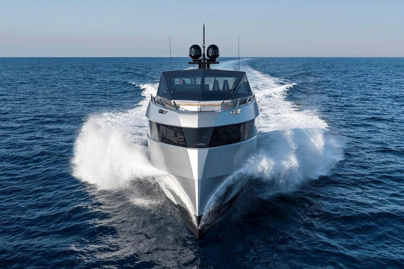 A sleek yacht cuts through the open sea, showcasing its modern design and powerful performance. aboard WALLYWHY200 Yacht for Sale