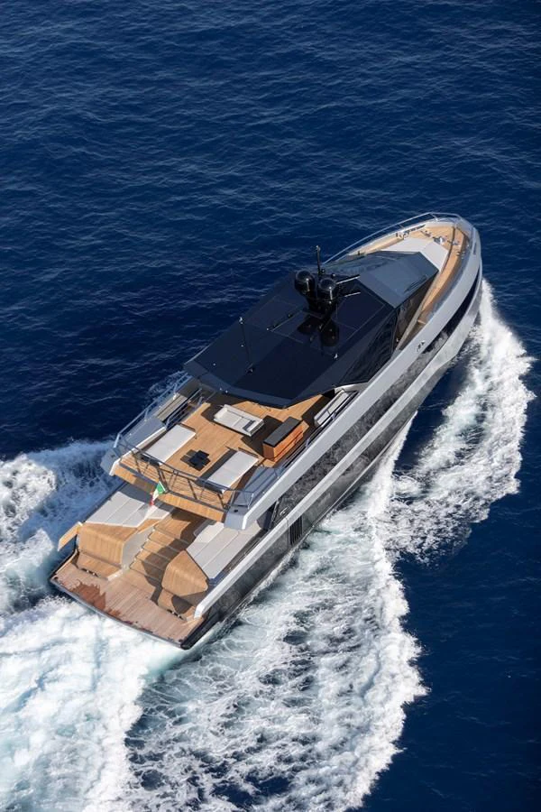 A sleek yacht cruises through the deep blue waters, showcasing its modern design and spacious decks. aboard WALLYWHY200 Yacht for Sale