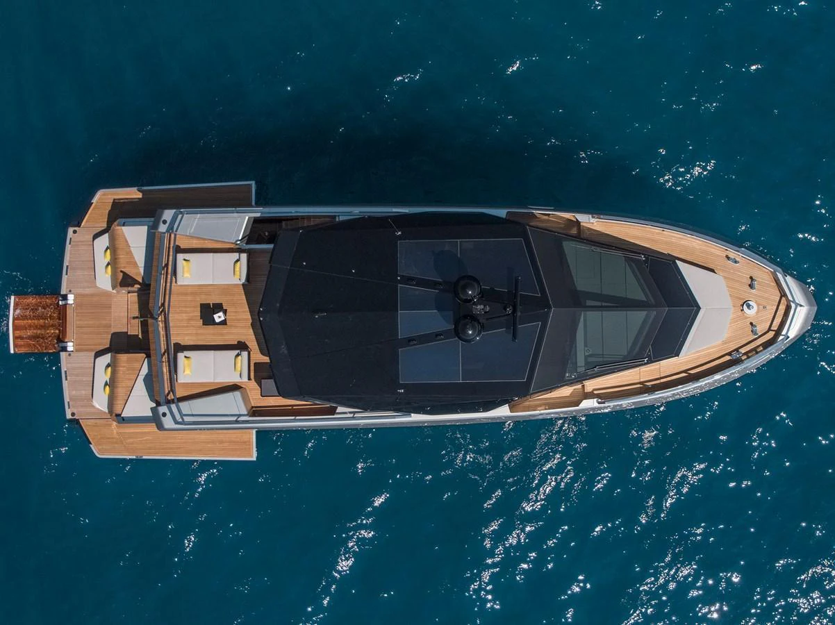 A sleek and modern yacht is captured from an aerial perspective, showcasing its elegant design and spacious deck areas. aboard WALLYWHY200 Yacht for Sale