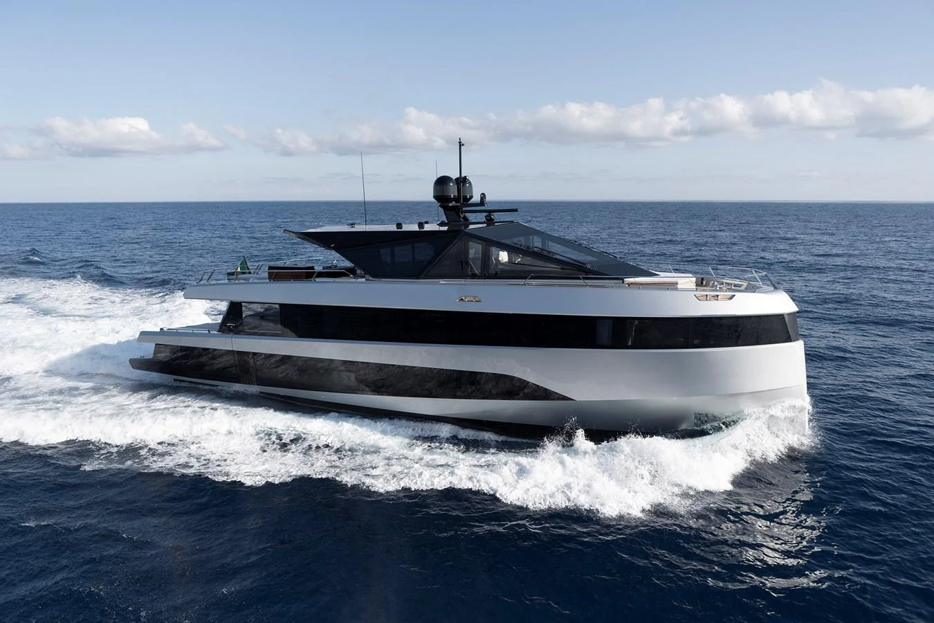 A sleek, modern yacht cruises through the open sea, showcasing its elegant design and powerful performance. aboard WALLYWHY200 Yacht for Sale