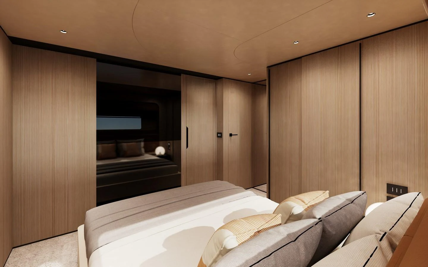 The stateroom features a luxurious bed with plush pillows and sleek wooden paneling. aboard A80NEW Yacht for Sale