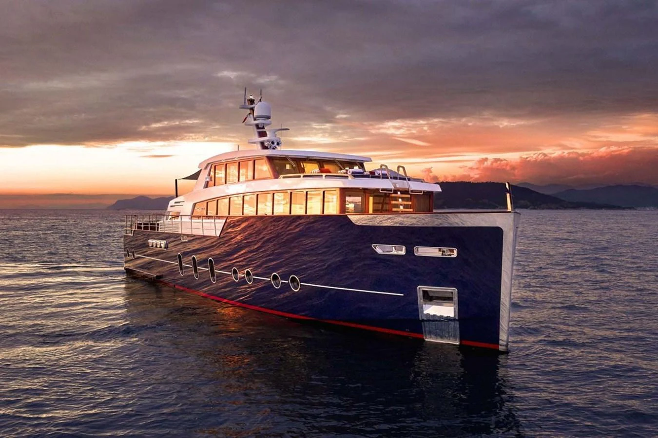 A stunning yacht glides through the water at sunset, showcasing its sleek design and luxurious features. aboard PICCHIOTTI 24 Yacht for Sale